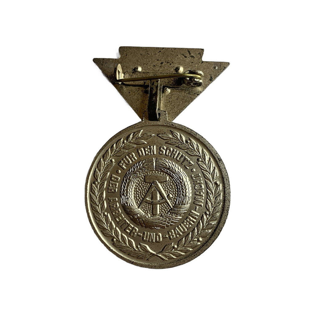 East German GDR Medal Schutz Arbeiter Bauern Macht Silver Pin DDR Stasi 1953. Vintage pre-owned item, actual item photographed by The Voyage Bird.
